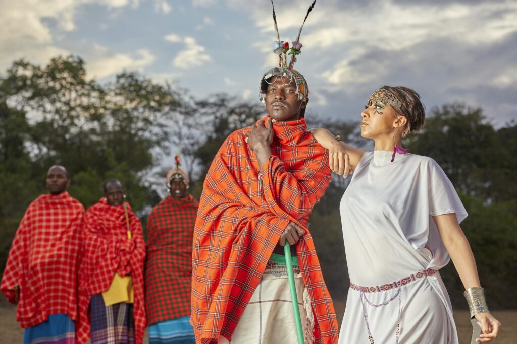 A vibrant group portrait showcasing traditional Maasai attire in Kenya's serene landscape.